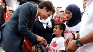 Justin Trudeau greeting people.